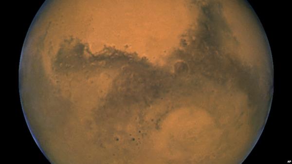 FILE - This Aug. 26, 2003, image made available by NASA shows Mars. Researchers in Australia have developed a new type of space communication that will allow high-definition video be sent from Mars.