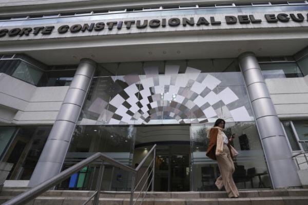 A woman exits the Co<em></em>nstitutional Court building, in Quito, Ecuador, February 7, 2024. 