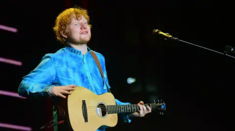 AFP British singer and so<em></em>ngwriter Ed Sheeran performs during a co<em></em>ncert in Mumbai on November 19, 2017. 