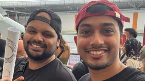 Dwayne Dias Dwayne Dias (left) and his friend pose for a photo at the co<em></em>ncert venue in Singapore, wher<em></em>e they had gone to watch Coldplay perform live
